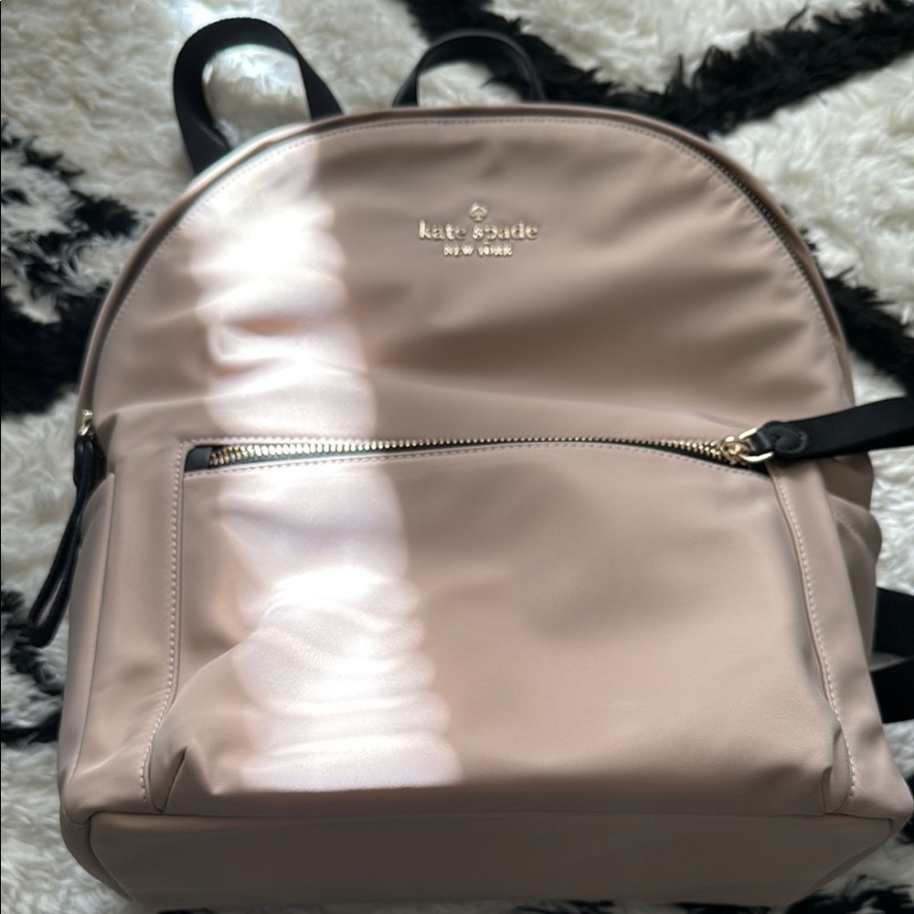 Kate Spade Creamy light pink Backpack with Structured Design.